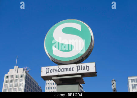 BERLIN, GERMANY - AUGUST 25, 2016: S-Bahn Urban Railway Station Sign Potsdamer Platz With Blurry Skyscrapers In The Background Stock Photo