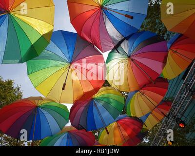 Colorful umbrellas on a background of blue sky Stock Photo