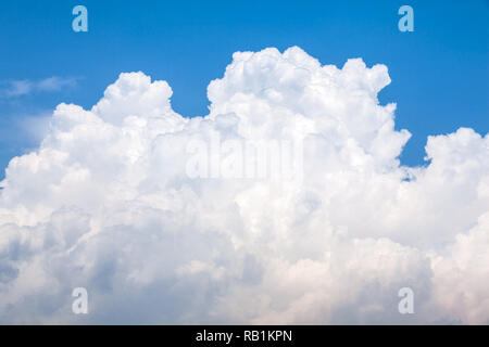 Big white puffy cloud on the blue sky Stock Photo