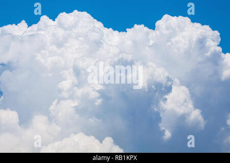 bright white puffy cloud on the blue sky Stock Photo