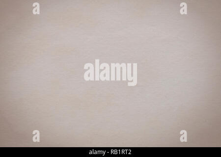 Light beige paper background, old off white paper. Textured sheet from an old book. Horizontal image. Stock Photo