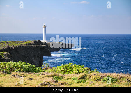 white lighthouse in cape zanpa in Japan with blue sea and sky