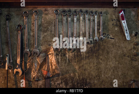Metal repair tools hanging on the wall of a turner's shop Stock Photo