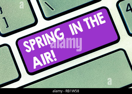 Handwriting text Spring In The Air. Concept meaning Natural feeling beautiful season flowers everywhere Keyboard key Intention to create computer mess Stock Photo