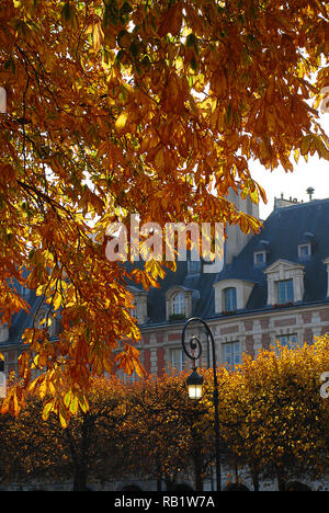 Places des Vosges in the autumn - Paris. The Place des Vosges, originally Place Royale, is the oldest planned square in Paris, France. Stock Photo