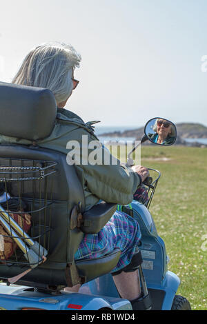 Mobility Buggy enabling a disabled person or physically impaired visitor, to access and explore the Isle of Iona. The Inner Hebrides. West coast of Scotland. Stock Photo