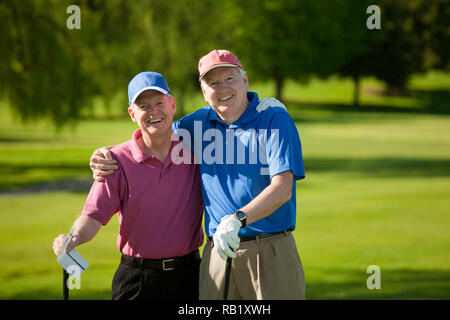 Two mature friends enjoying a young of golf, USA Stock Photo