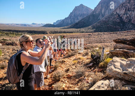 A hiking guide and a group of hikers at Red Rock Canyon near Las Vegas Nevada Stock Photo
