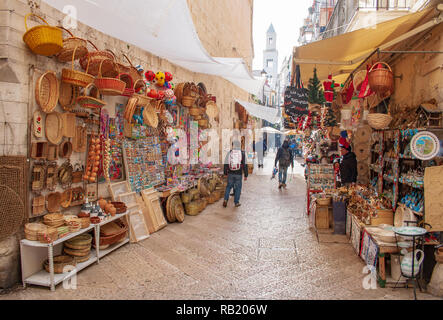 View of a narrow street in  Bari, Puglia, Italy, Bari vecchia, traditional open market shops with souvenir for tourists Stock Photo