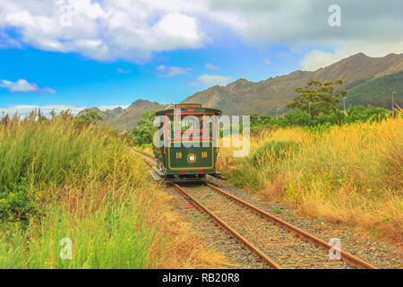 Franschhoek Wine Tram hop-on hop-off tour, one of the best ways to discover Franschhoek Valley in scenic landscape of Wine Region, near Cape Town, Sou Stock Photo