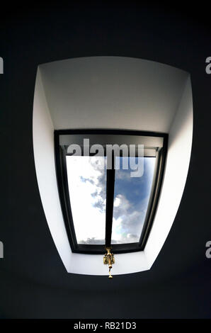 velux style opening skylight  in bedroom roof Stock Photo