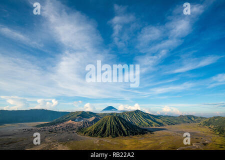 Bromo mountain , day time with dramatic cloud on blue sky Stock Photo