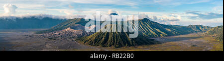 Bromo mountain , day time with dramatic cloud on blue sky, panorama. Stock Photo