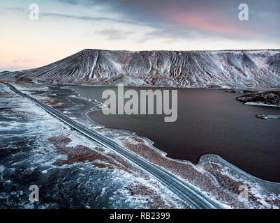 Kleifarvatn lake in Iceland in winter with scenic road aerial view Stock Photo