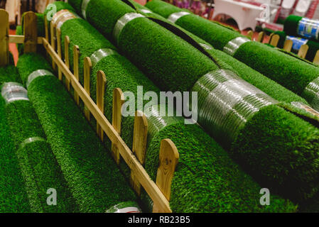 Valencia, Spain - January 3, 2019: Rolls of fake plastic grass to reform gardens. Stock Photo