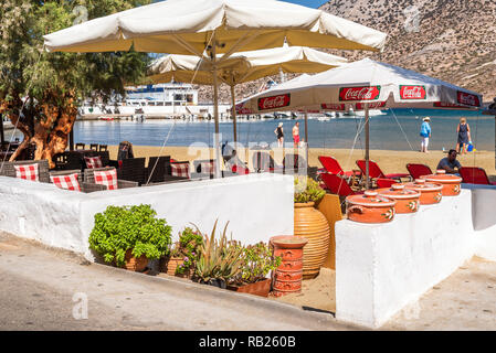 SIFNOS, GREECE - September 10, 2018: Traditional Greek tavern along seaside promenade. Sifnos island, Greece Stock Photo