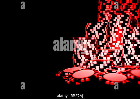 Stack of Red Poker chips isolated on a black background. poker table. Poker game concept. Playing a game with dice. Casino Concept for business risk c Stock Photo