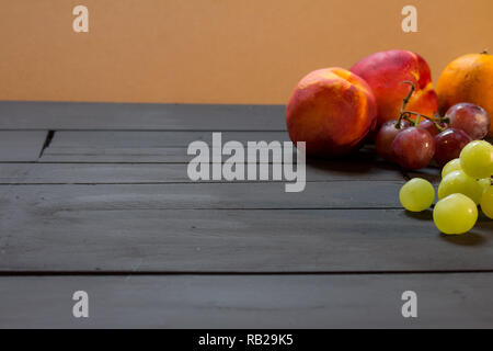Group of fruits on a rustic background. Fruits of fresh colors. Stock Photo