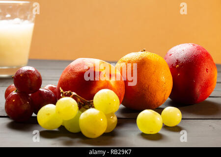 Group of fruits on a rustic background. Fruits of fresh colors. Stock Photo