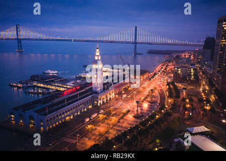 Aerial Cityscape View of San Francisco Ferry Building and Embarcadero at Dusk Stock Photo