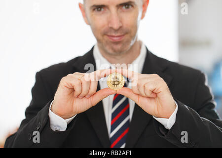 Bitcoin in the both hands Stock Photo