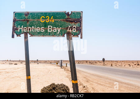 road sign indicating Henties Bay 48 in the C34 road, Namibia Stock Photo