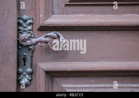 Iron door handle of an old door of a historical building Stock Photo