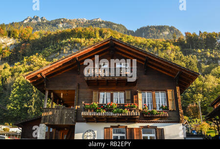 Traditional Swiss alps rural wood house in village of Alpine, Switzerland. Stock Photo