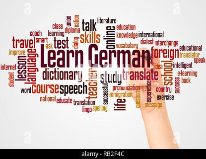 Learn German word cloud and hand with marker concept on white background. Stock Photo