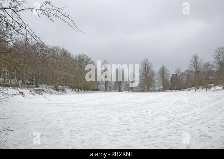 Late winter snow on a popular walk through Squerryes Park between Westerham, Hosey Common and Chartwell in Kent. March 2018 Stock Photo