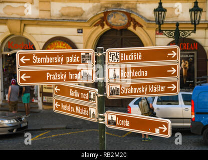 PRAGUE, CZECH REPUBLIC - JULY 2018: Tourist information sign in Prague city centre showing directions to the city's landmarks. Stock Photo