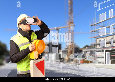 A Worker on Construction site with VR glasses smart city Stock Photo