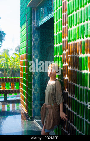 Asian female model poses for pictures in the outdoors Stock Photo
