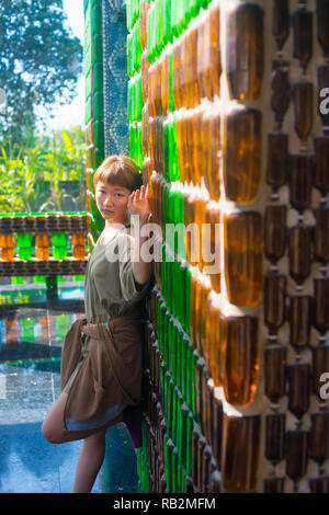 Asian female model poses for pictures in the outdoors Stock Photo