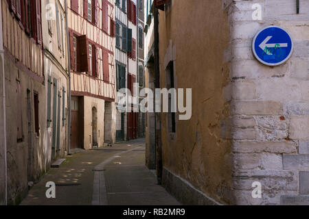 Narrow curved street in Bayonne, France. Stock Photo