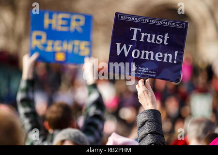 A participant holds a 'Trust Women' sign over a large crowd during the 2018 Women's March Rally on Saturday January 20th. Stock Photo