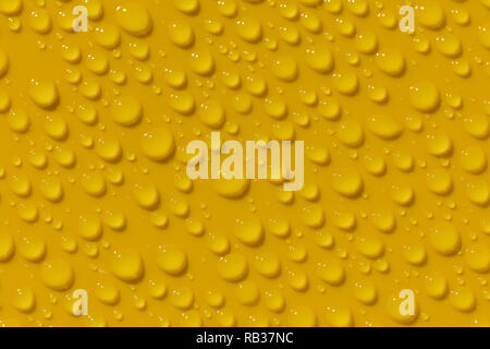 Morning dew on yellow plastic surface Stock Photo