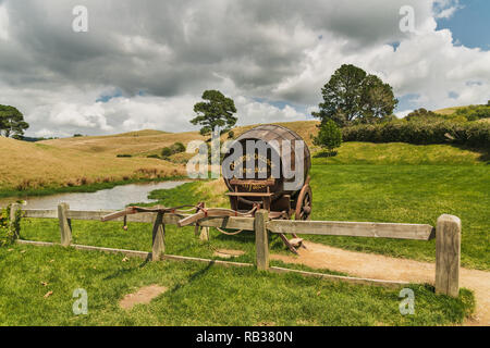 Scenery View of Hobbiton Village, Wooden Barrel in Hobbiton Movie Seat, Matamata, New Zealand, 01/21/2018 Stock Photo