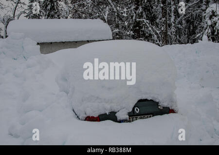 a car completely covered with snow Stock Photo