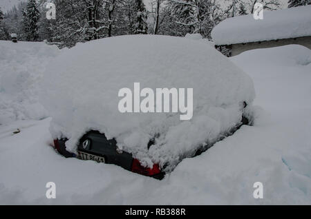 a car completely covered with snow Stock Photo