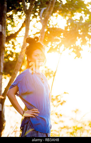 Asian female model poses for pictures in the outdoors Stock Photo