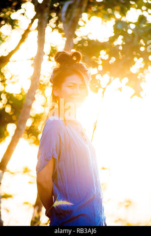 Asian female model poses for pictures in the outdoors Stock Photo