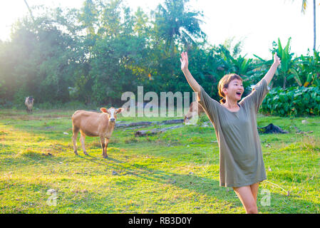 Asian female model poses for pictures in the nature Stock Photo