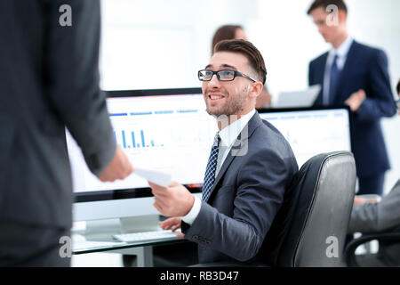 businessman working on a computer on business reports Stock Photo