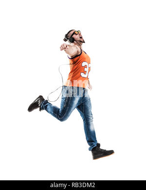 emotional and charming guy - rapper in headphones takes the danc Stock Photo