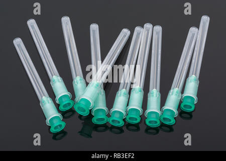 Close-up of hypodermic needles. Specifically BD Microlance brand - Green 21G 1' / 0.8x25mm. Metaphor NHS, inoculation, flu jab. Stock Photo