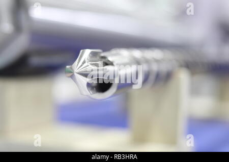 Screw press parts for plastic injection machine ; selective focus Stock Photo