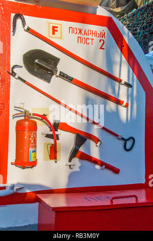 Fire plan red shovel ax pic on a old sailing ship Stock Photo