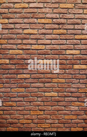 Vertical Red brick wall texture grunge background with vignetted corners. Stock Photo