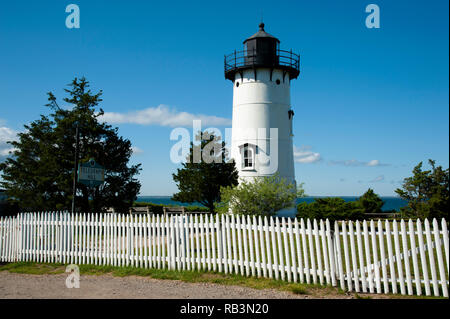 An old white picket fence surrounds East Chop lighthouse tower, on Telegraph Hill, on Martha’s Vineyard Island. It is a popular attraction for the man Stock Photo